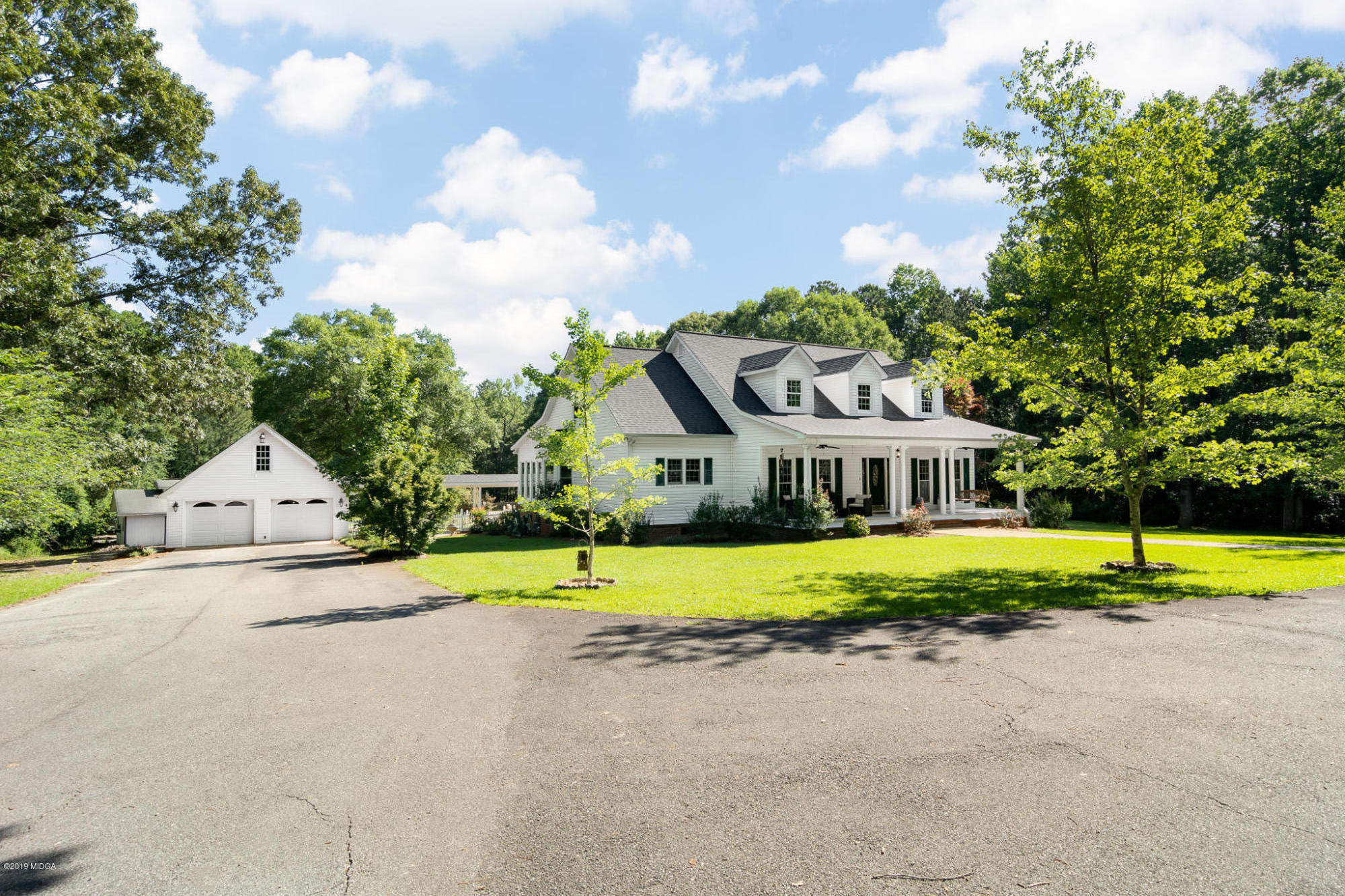 241 Country Creek Road Macon, GA 31220 - Photo 2 of 26 a house with garden in front of it