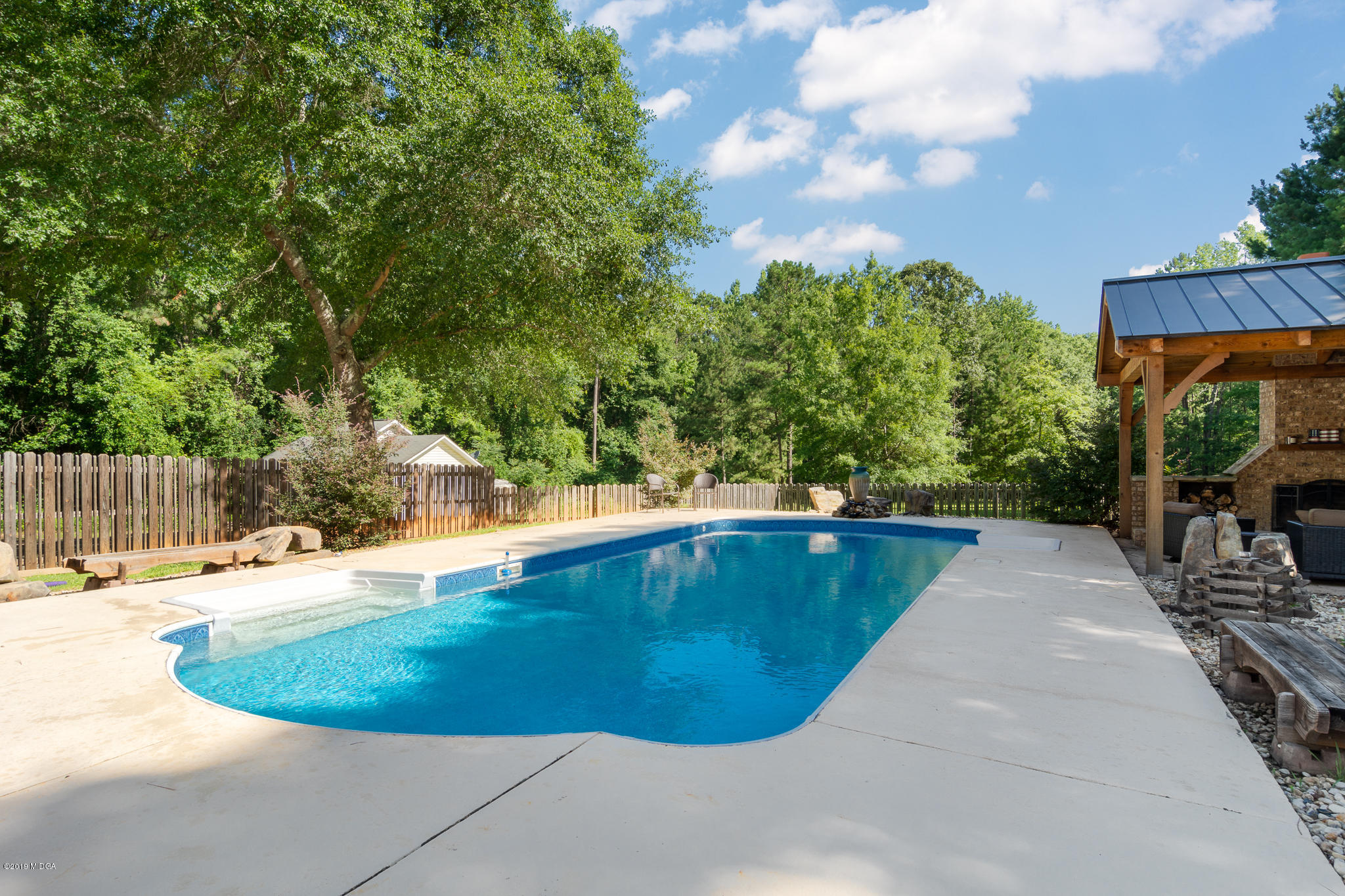 241 Country Creek Road Macon, GA 31220 - Photo 11 of 26 a view of a swimming pool with an outdoor space