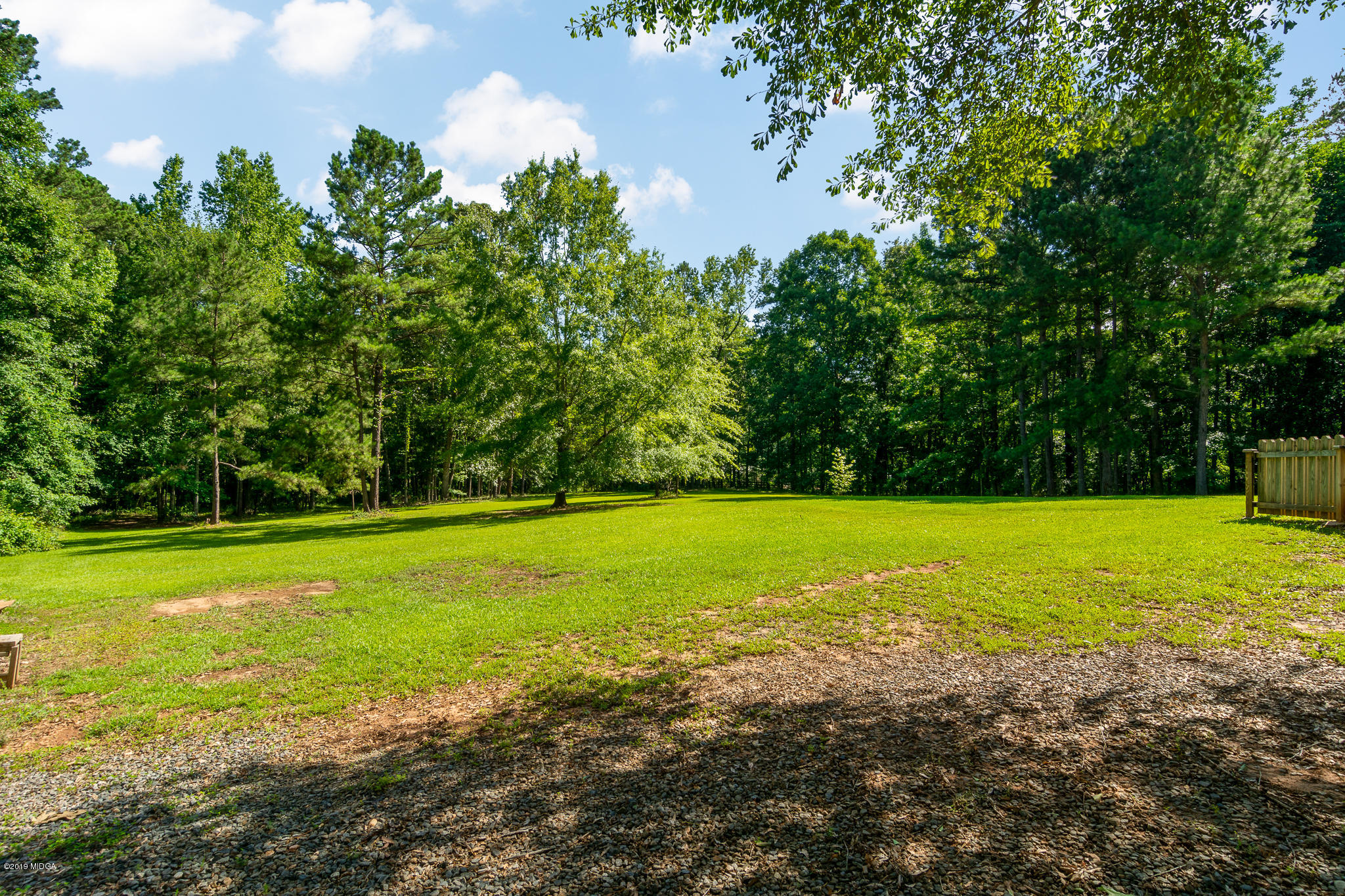 241 Country Creek Road Macon, GA 31220 - Photo 13 of 26 a view of a golf course with a lake