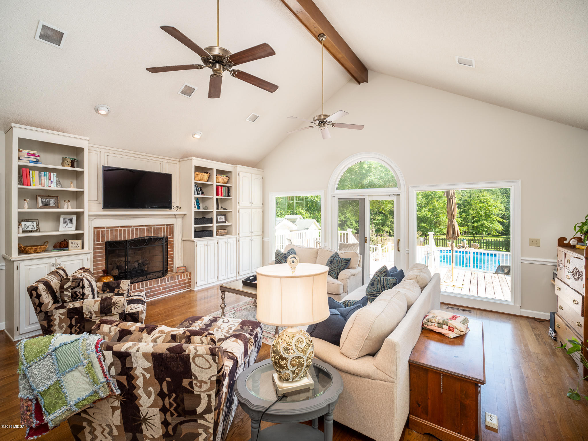 241 Country Creek Road Macon, GA 31220 - Photo 14 of 26 a living room with furniture fireplace and a large window