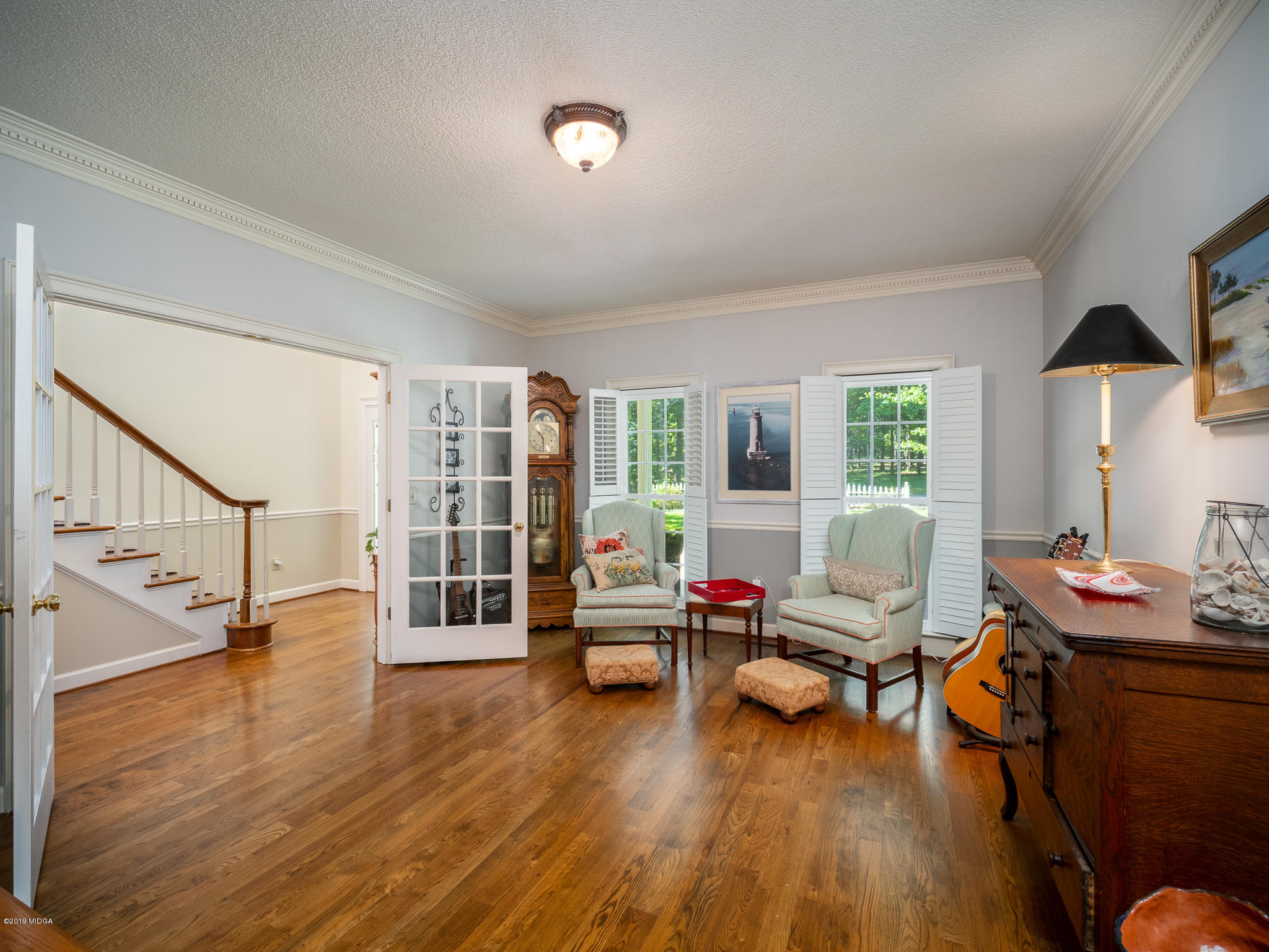241 Country Creek Road Macon, GA 31220 - Photo 18 of 26 a living room with furniture and wooden floor