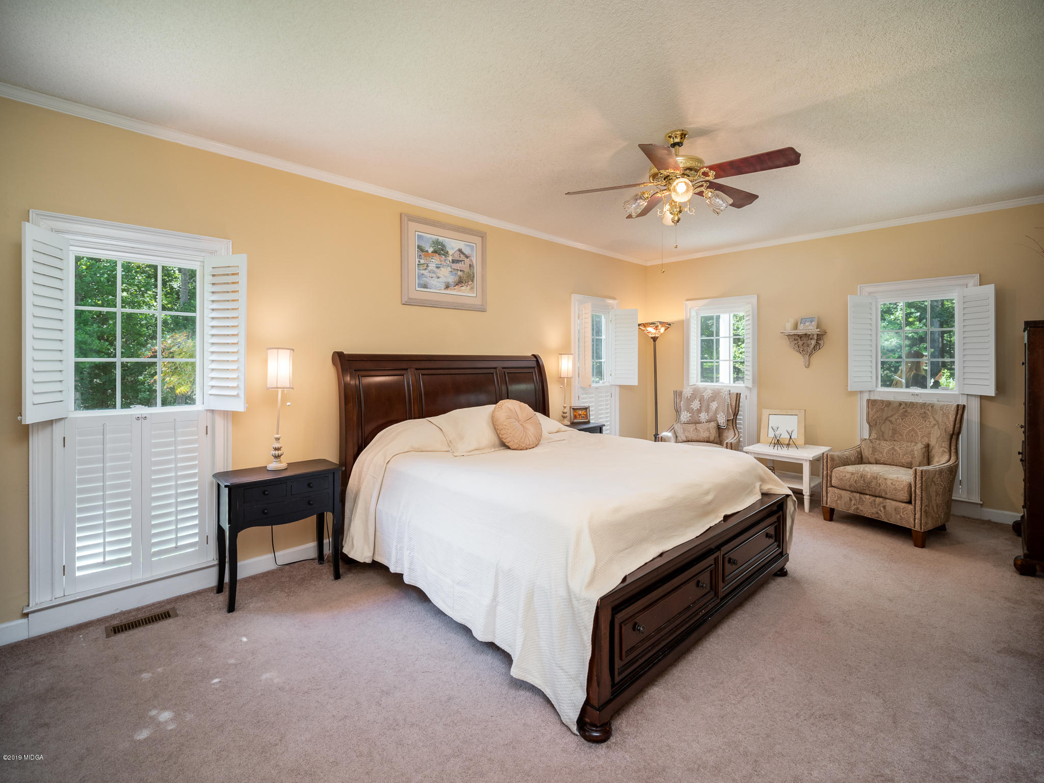 241 Country Creek Road Macon, GA 31220 - Photo 20 of 26 a bedroom with a bed couch and window