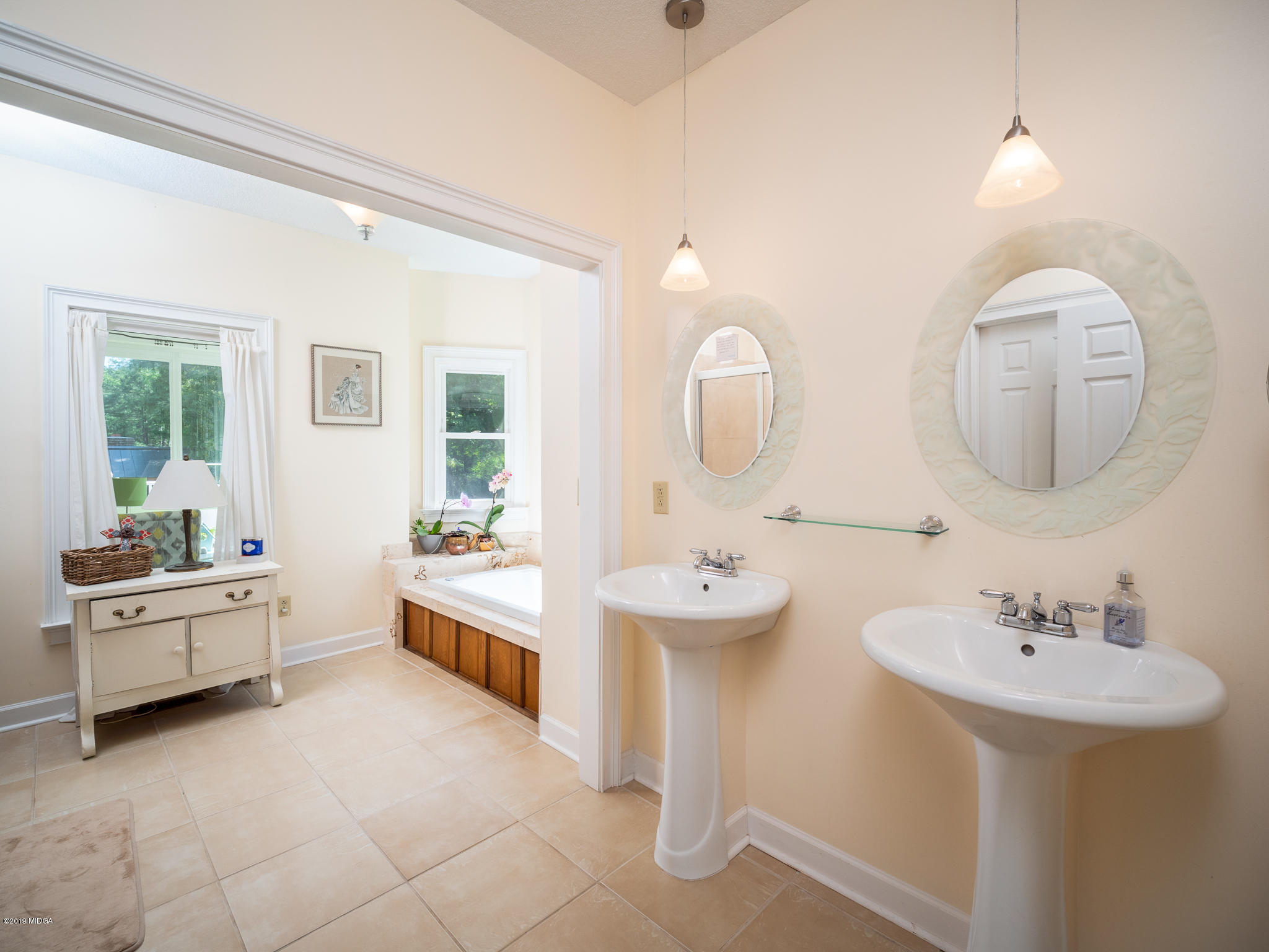 241 Country Creek Road Macon, GA 31220 - Photo 22 of 26 a large bathroom with a double vanity sink and a mirror