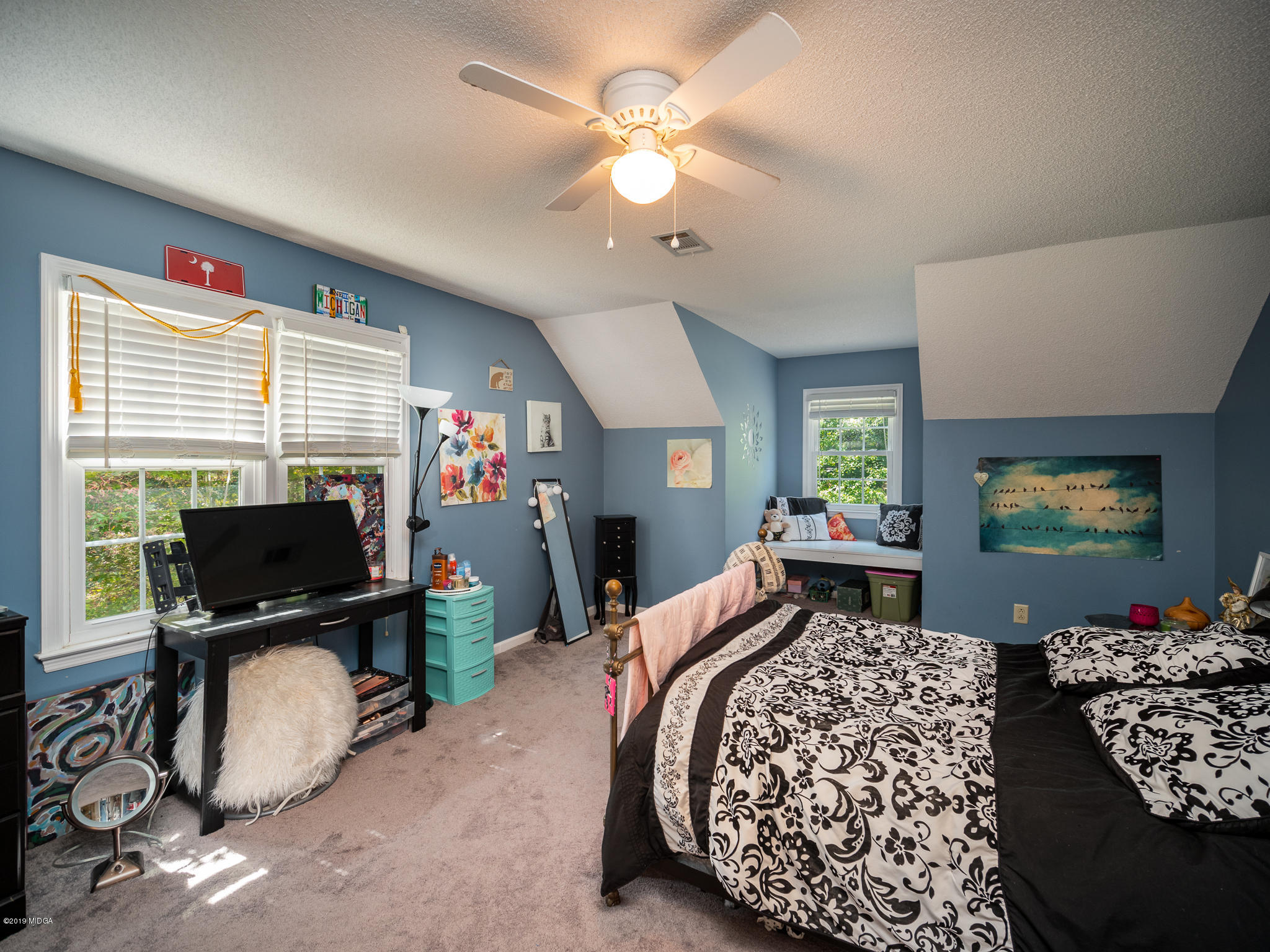 241 Country Creek Road Macon, GA 31220 - Photo 24 of 26 a bedroom with furniture a flat screen tv and a window