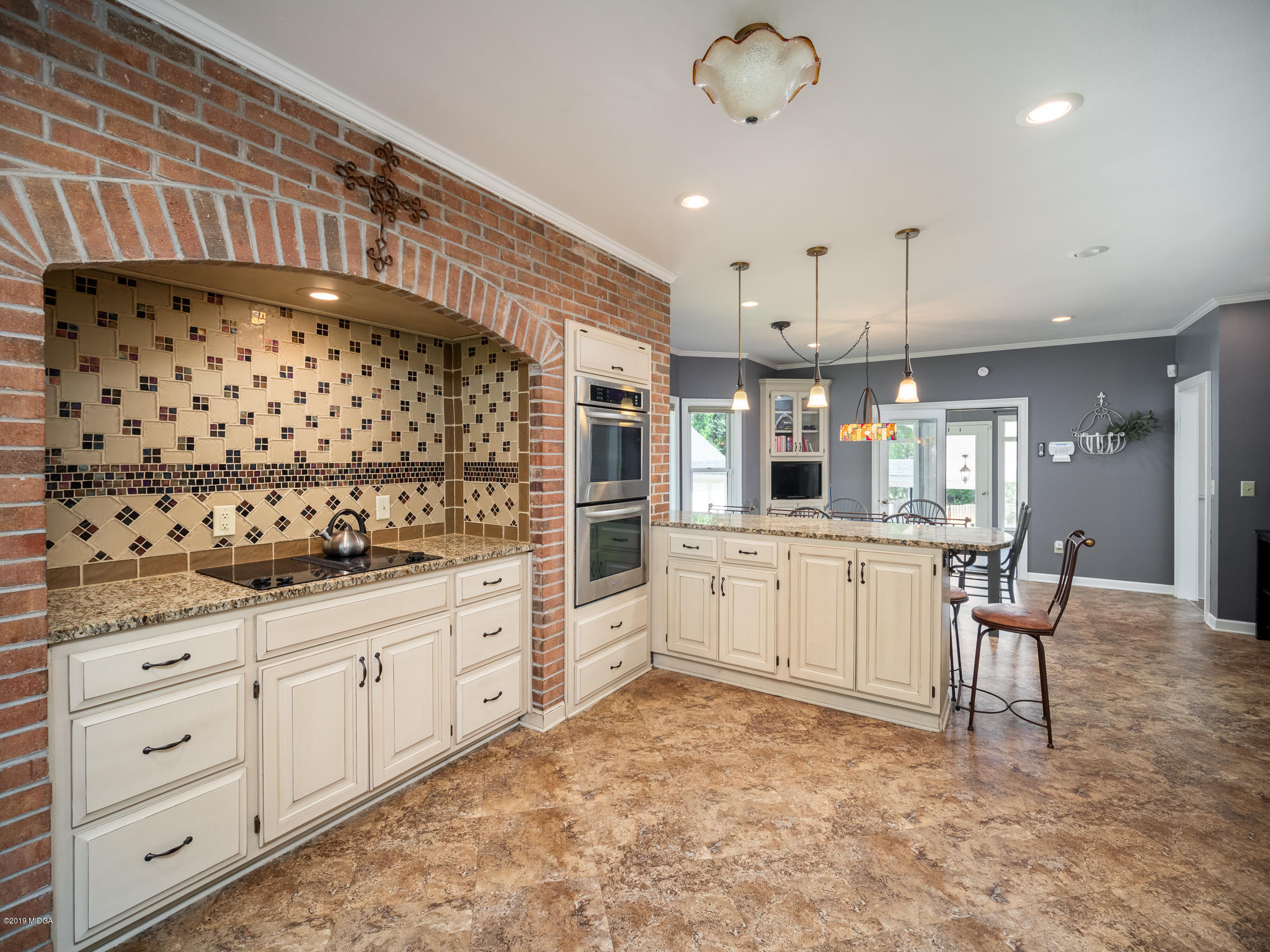 241 Country Creek Road Macon, GA 31220 - Photo 5 of 26 a kitchen with granite countertop white cabinets and white appliances