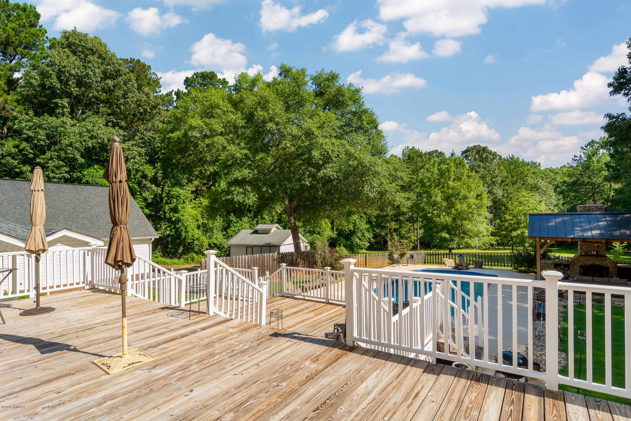 241 Country Creek Road Macon, GA 31220 - Photo 9 of 26 a view of a deck with two chair and table