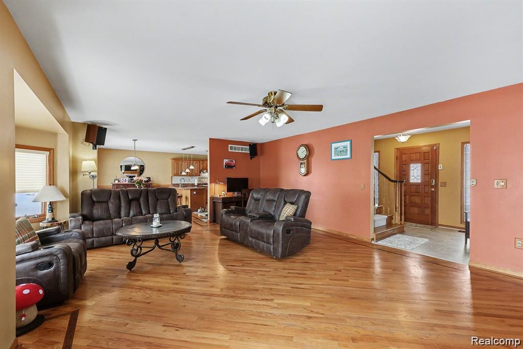 7277 Cardinal Road Algonac, MI 48001 - Photo 15 of 36 Living room with a ceiling fan and light wood finished floors