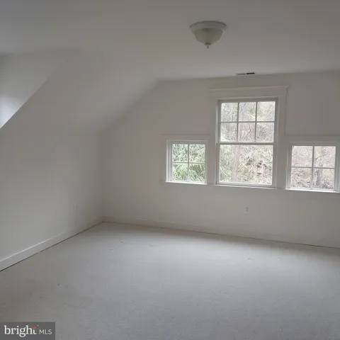 a utility room with cabinets washer and dryer
