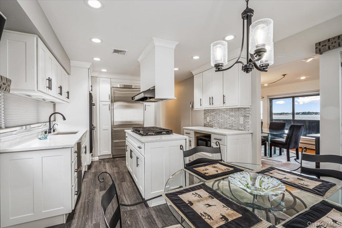 154-43 Riverside Drive Queens, NY 11357 - Photo 20 of 41 a kitchen with a sink appliances and cabinets