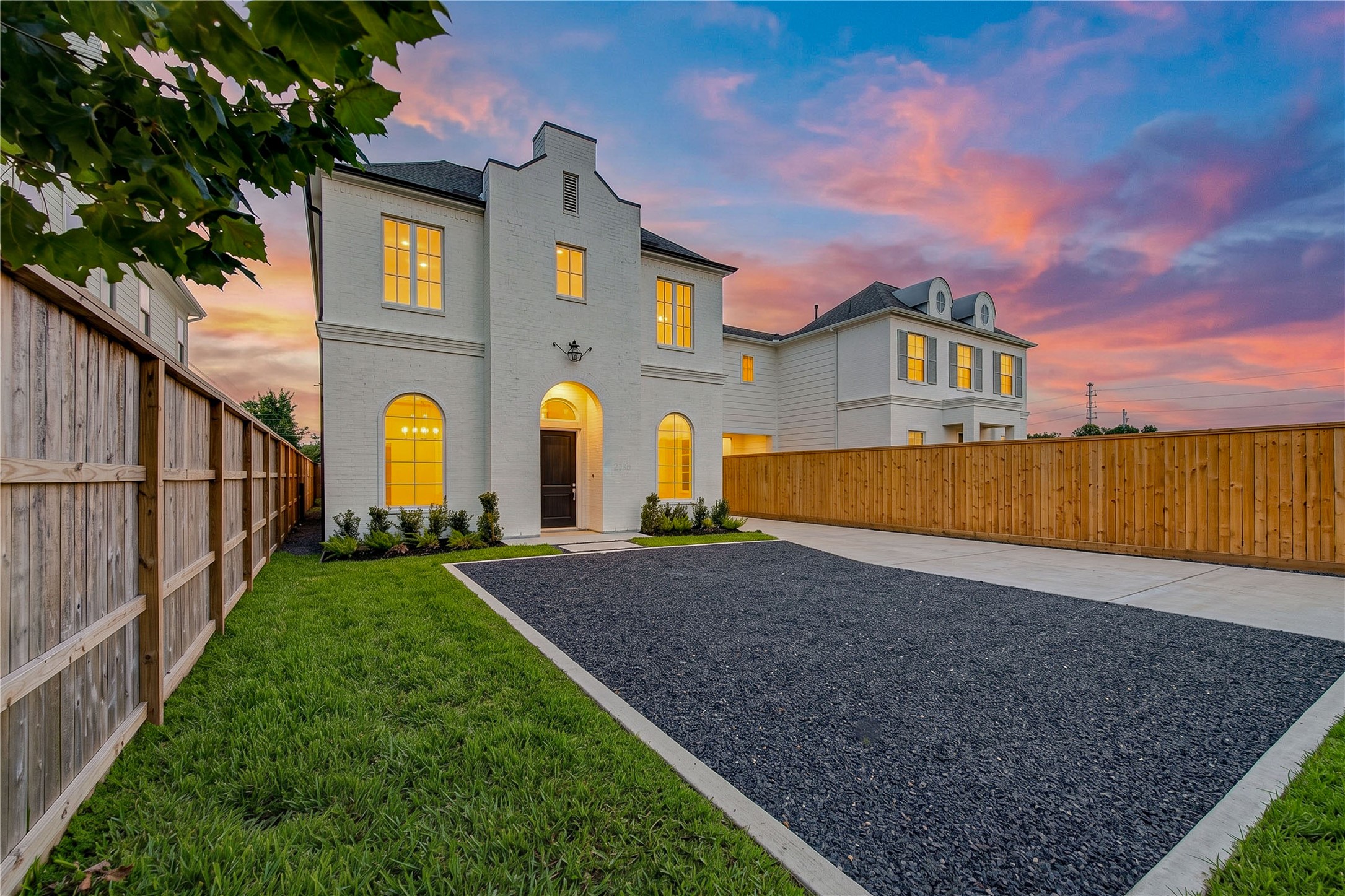 2309 Hollister Road Houston, TX 77080 - Photo 2 of 47 Impressive gated motor court provides generous private parking, complemented by manicured lawn space and the home’s striking modern architectural design.