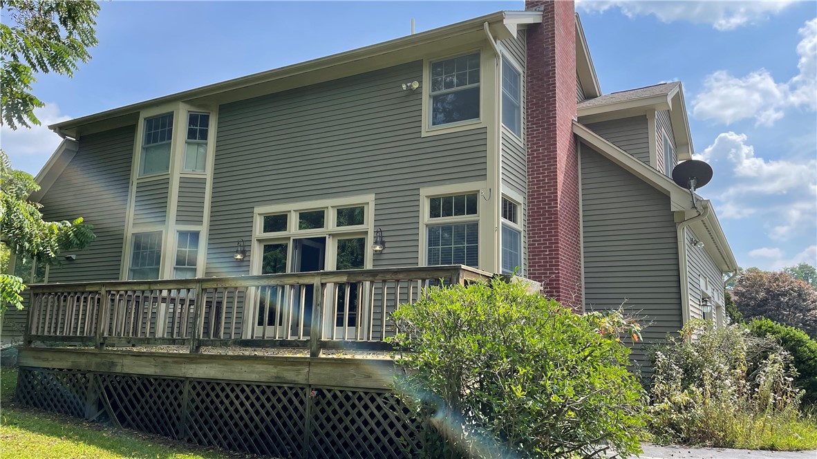15 Jacobs Point Road Warren, RI 02885 - Photo 15 of 44 Full dormer Cape with a large french door to access the wood deck.