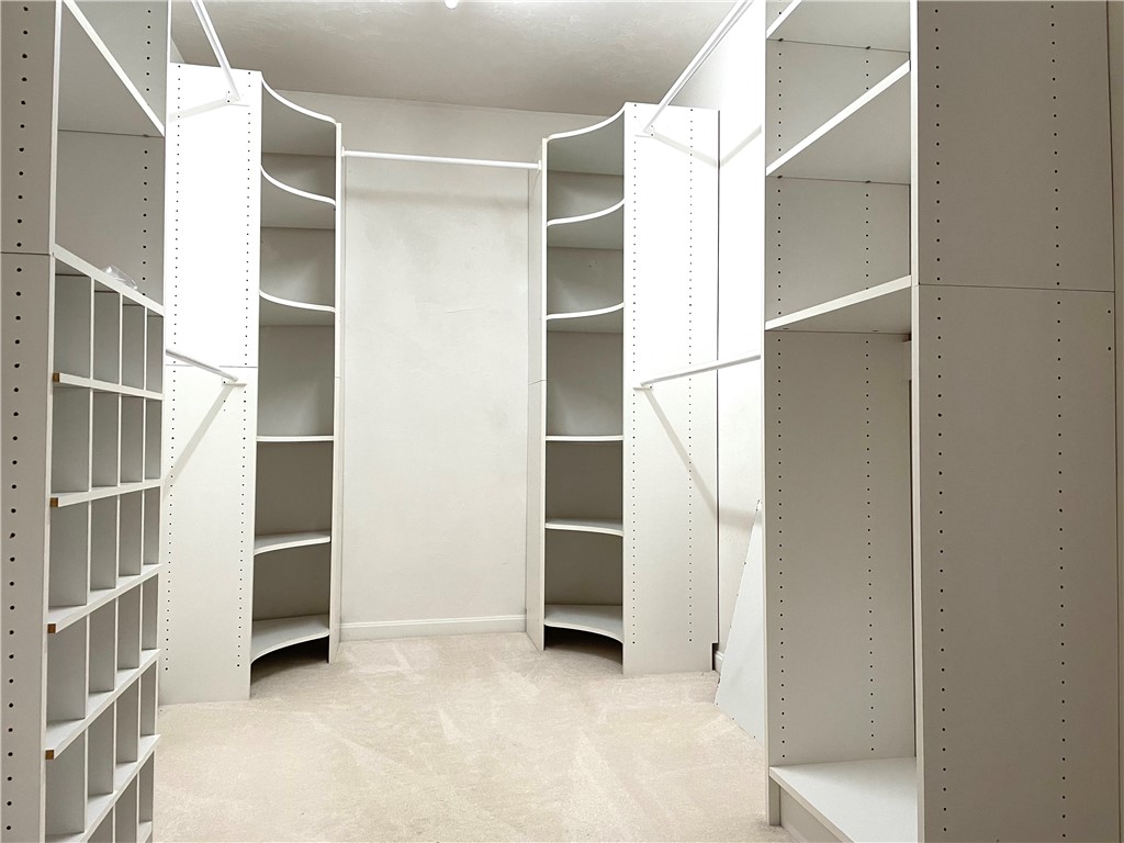 15 Jacobs Point Road Warren, RI 02885 - Photo 25 of 44 Master bedroom custom built closet offers ample storage and has attic access.