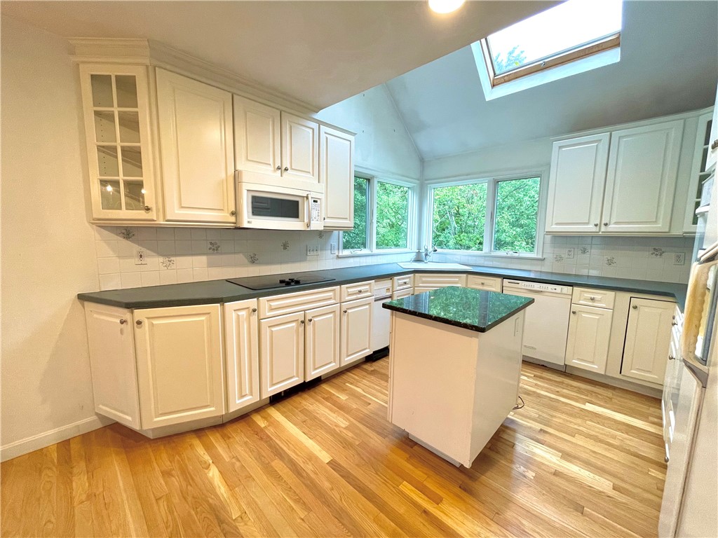 15 Jacobs Point Road Warren, RI 02885 - Photo 8 of 44 Light filled kitchen from overhead skylight.