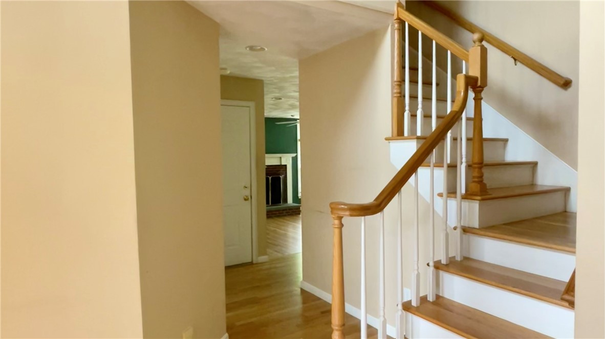 15 Jacobs Point Road Warren, RI 02885 - Photo 9 of 44 Beautiful large entry foyer showcases the pretty staircase which has an open floor design that enters into formal livimg room, dining room and towards the back the fireplaced family room & kitchen.