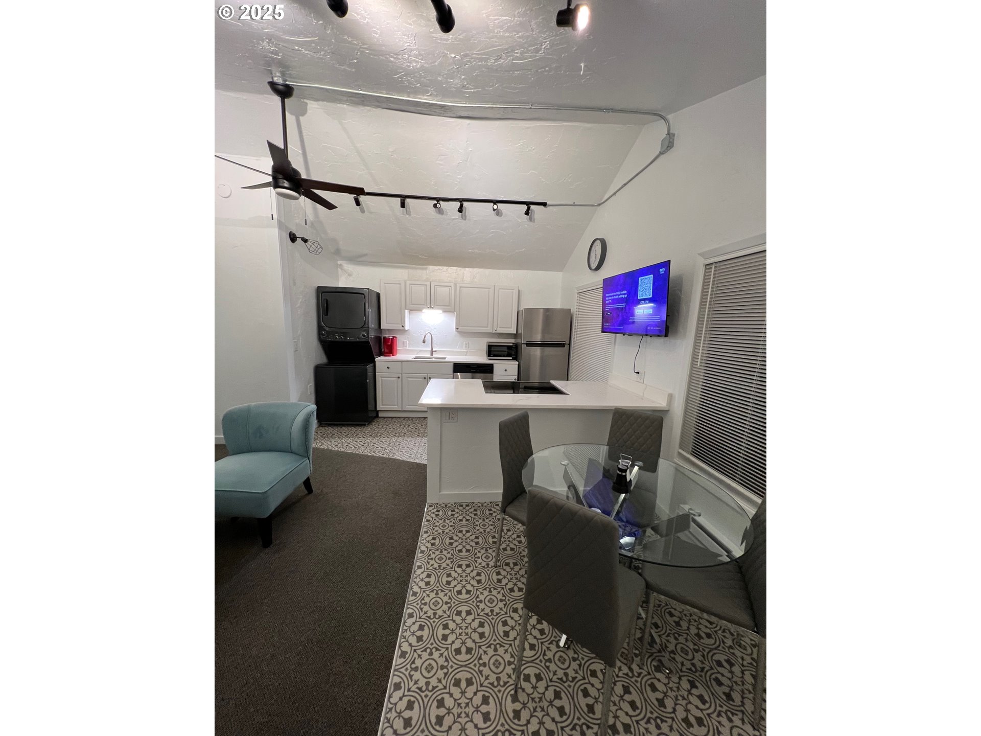 734 East 14th Avenue Eugene, OR 97401 - Photo 11 of 27 a living room with furniture and a chandelier