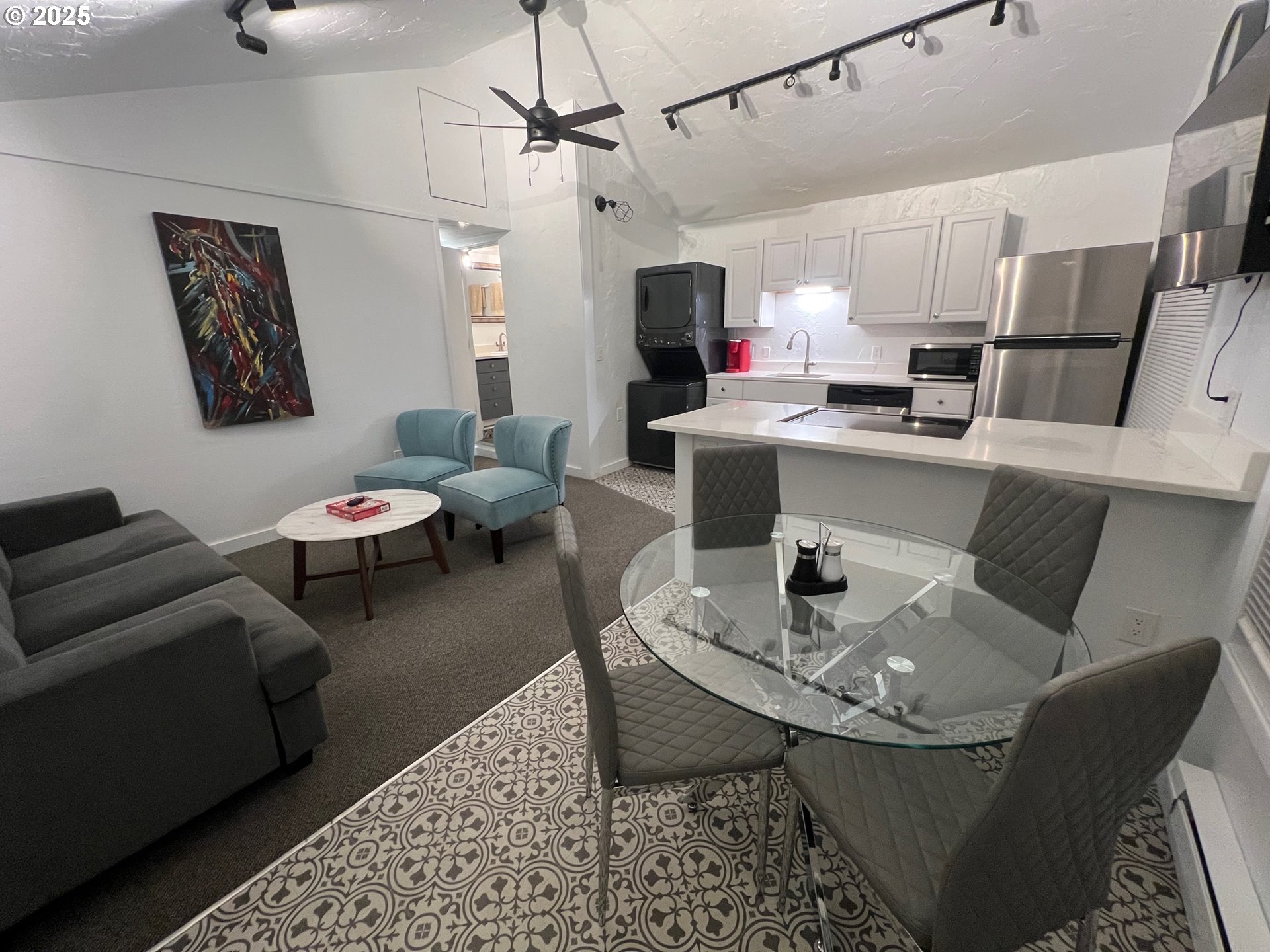 734 East 14th Avenue Eugene, OR 97401 - Photo 19 of 27 a living room with lots of furniture and kitchen view