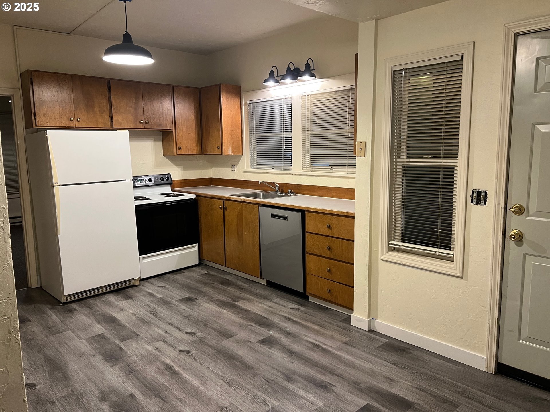 734 East 14th Avenue Eugene, OR 97401 - Photo 23 of 27 a kitchen with stainless steel appliances granite countertop a refrigerator a sink dishwasher a stove and a refrigerator