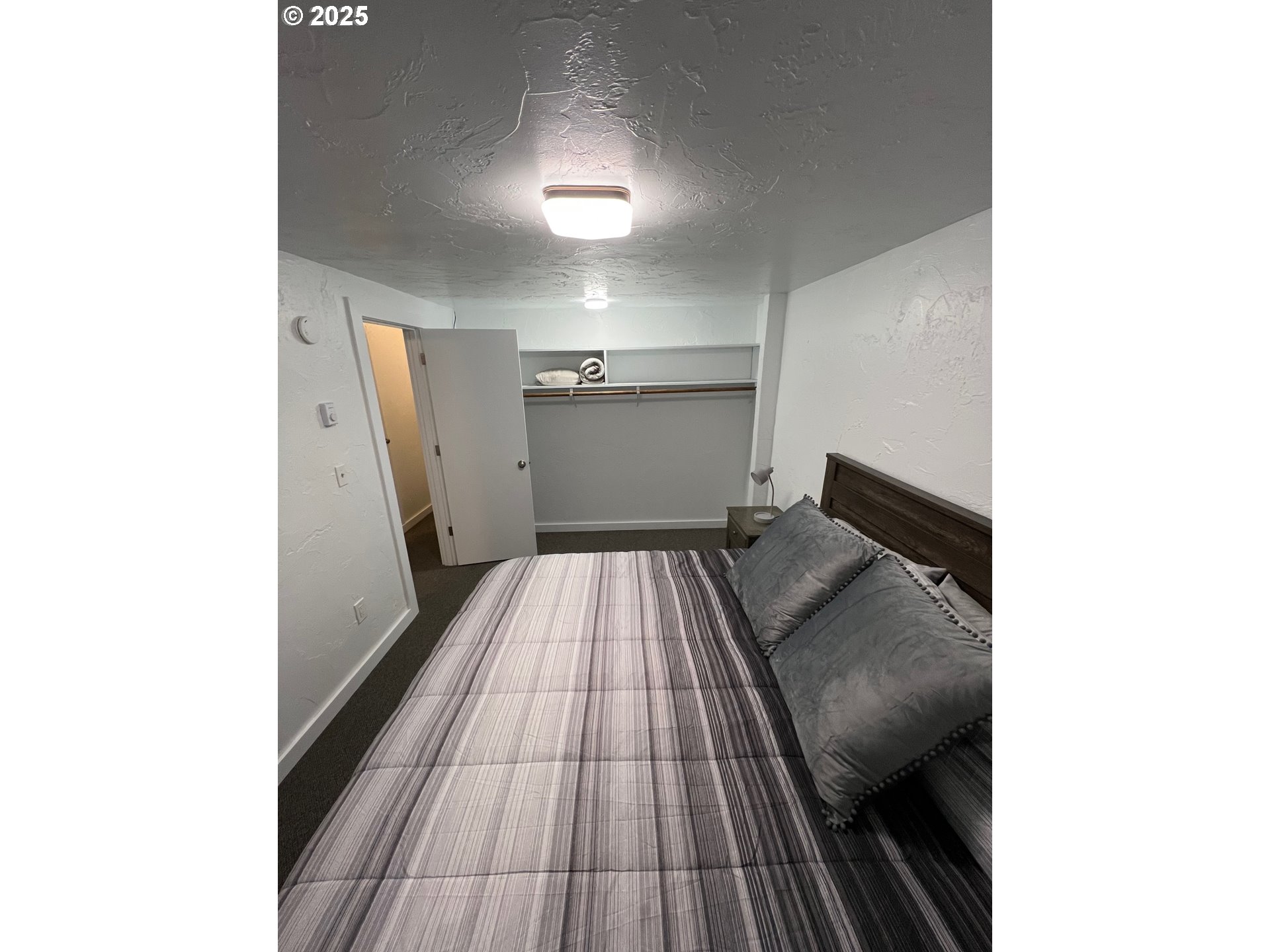 734 East 14th Avenue Eugene, OR 97401 - Photo 5 of 27 a view of a hallway with wooden floor