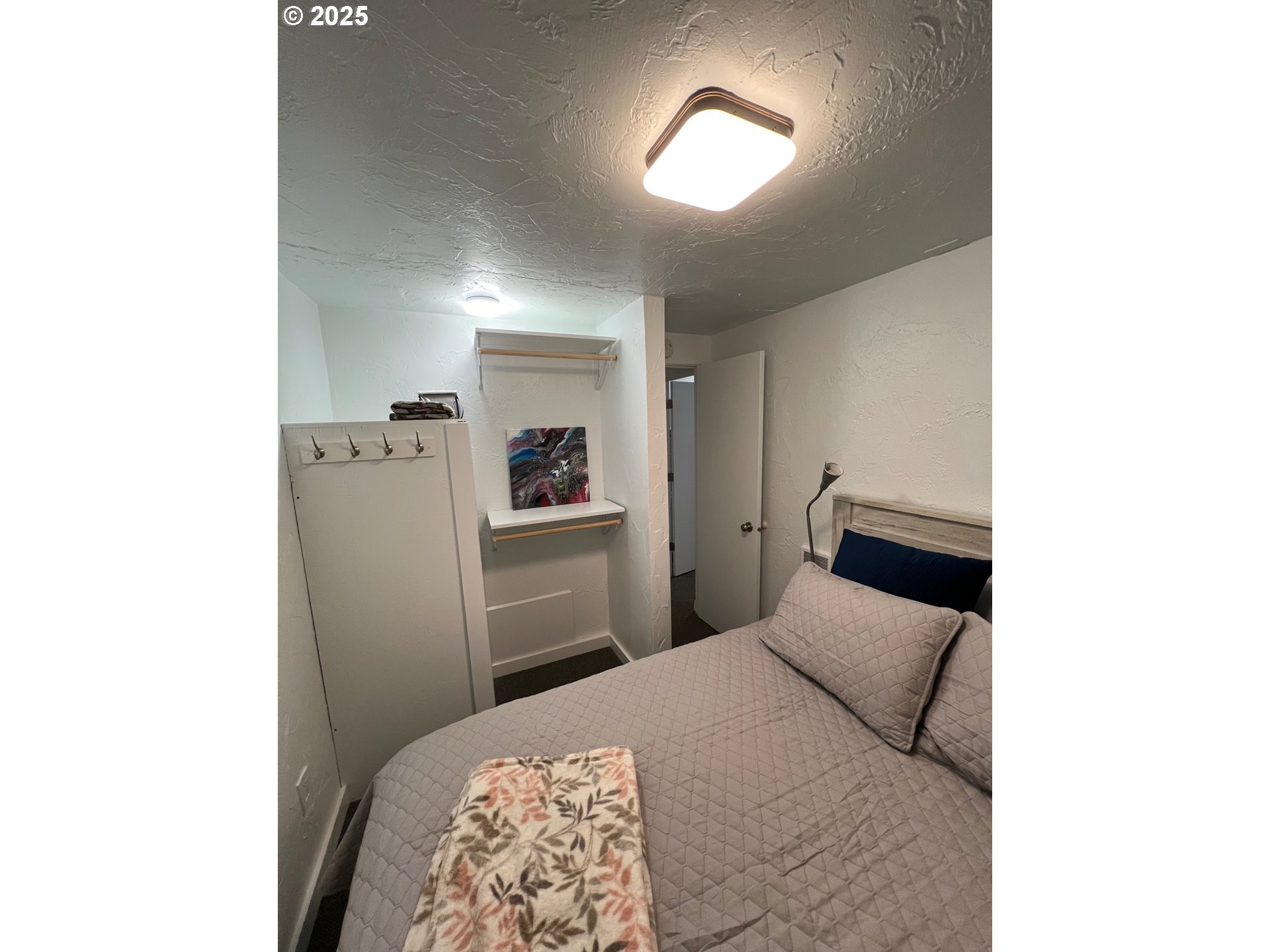 734 East 14th Avenue Eugene, OR 97401 - Photo 6 of 27 a bedroom with a bed and a window