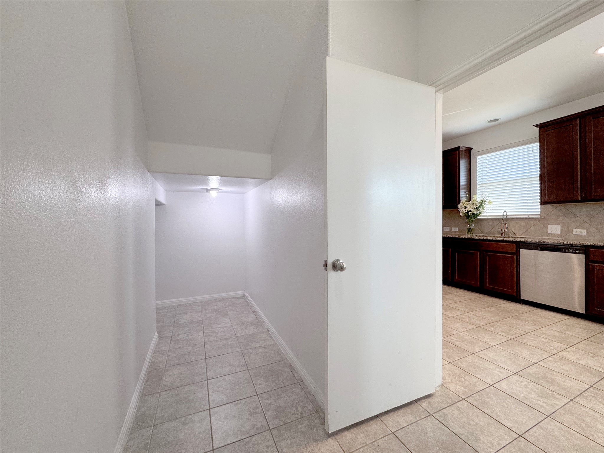 251 Triumph Road Buda, TX 78610 - Photo 10 of 26 Hall featuring baseboards and light tile patterned flooring
