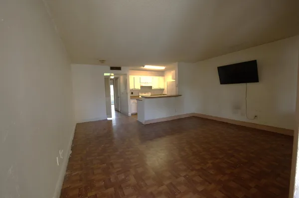 a kitchen with a stove and a refrigerator