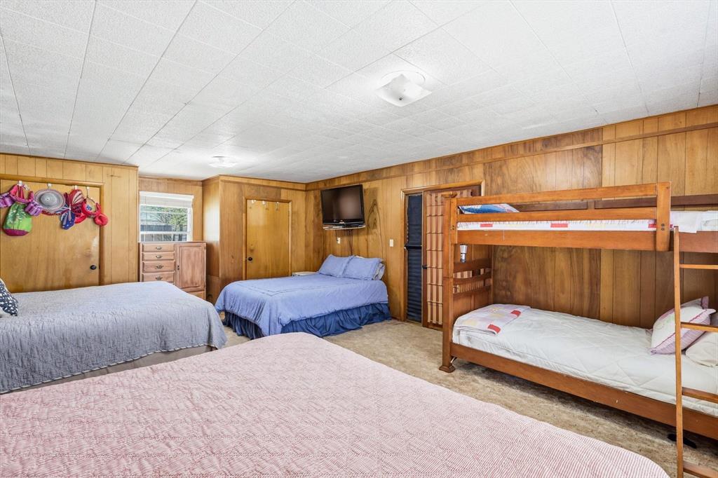 4513 Chapel Road Graham, TX 76450 - Photo 15 of 38 a bedroom with two beds and a window