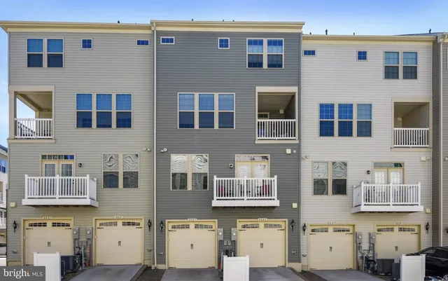 a front view of a building with many windows