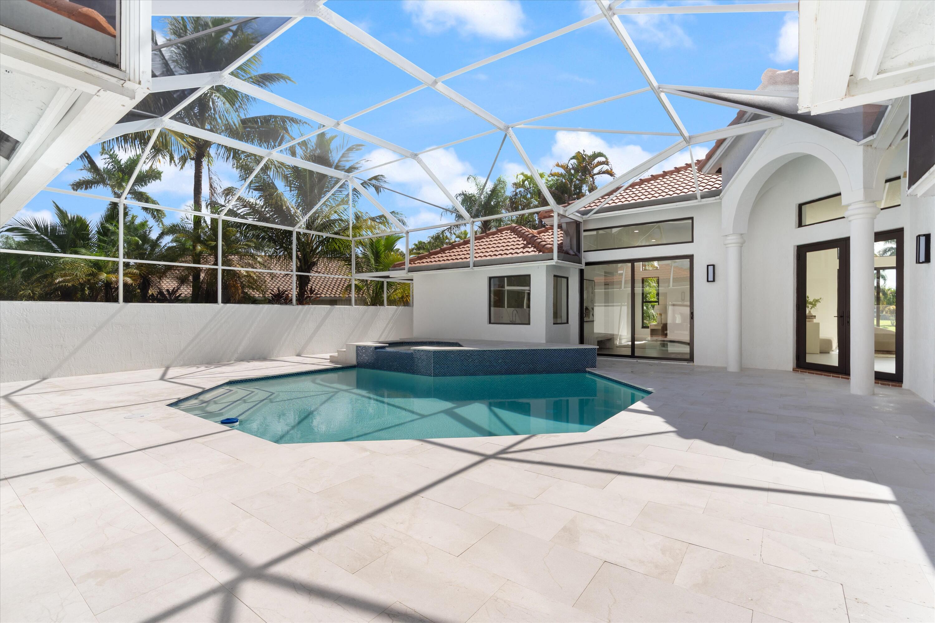 20209 Ocean Key Drive Boca Raton, FL 33498 - Photo 23 of 38 a front view of a house with garden