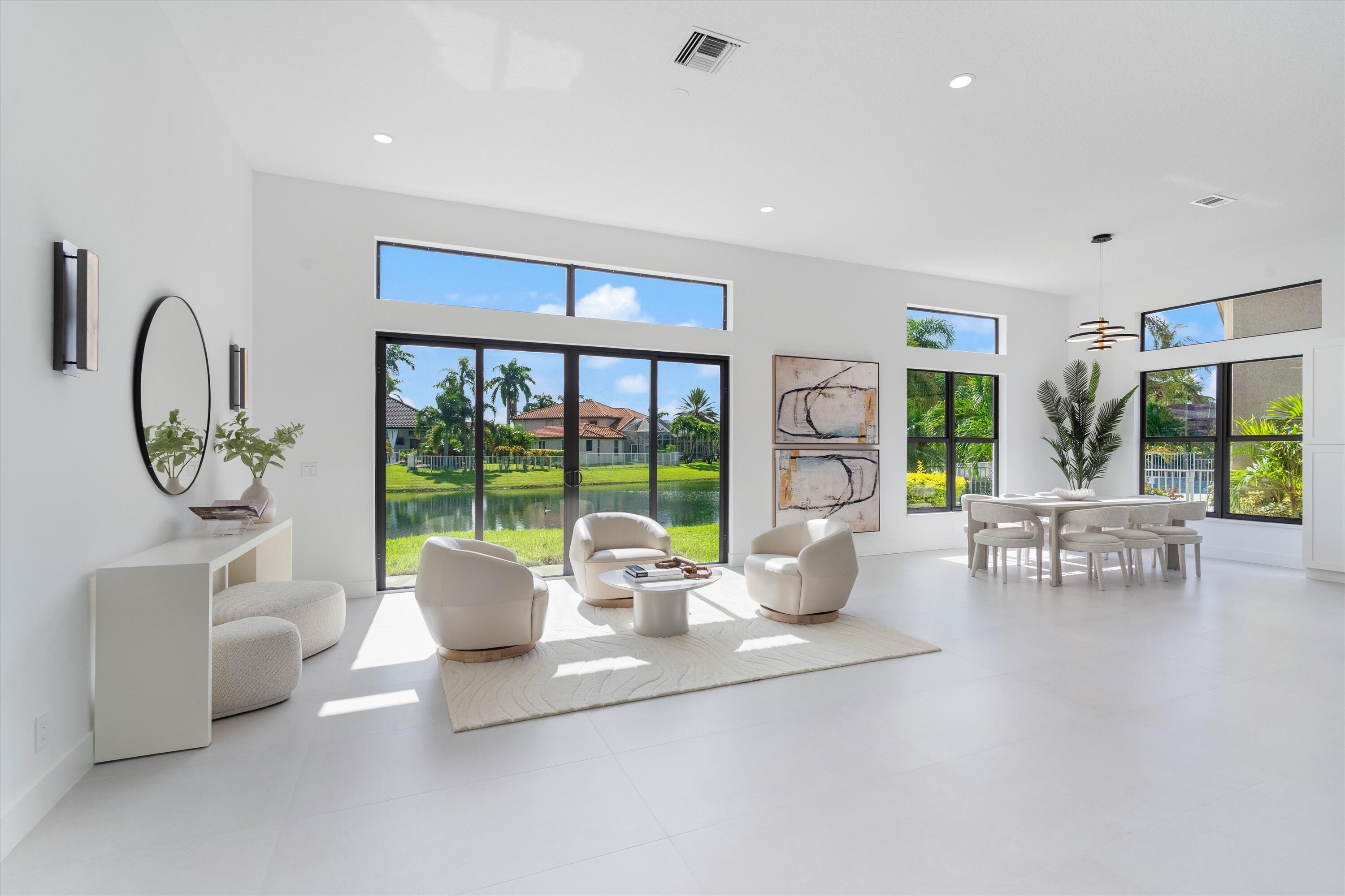 20209 Ocean Key Drive Boca Raton, FL 33498 - Photo 3 of 38 a living room with furniture and a large window