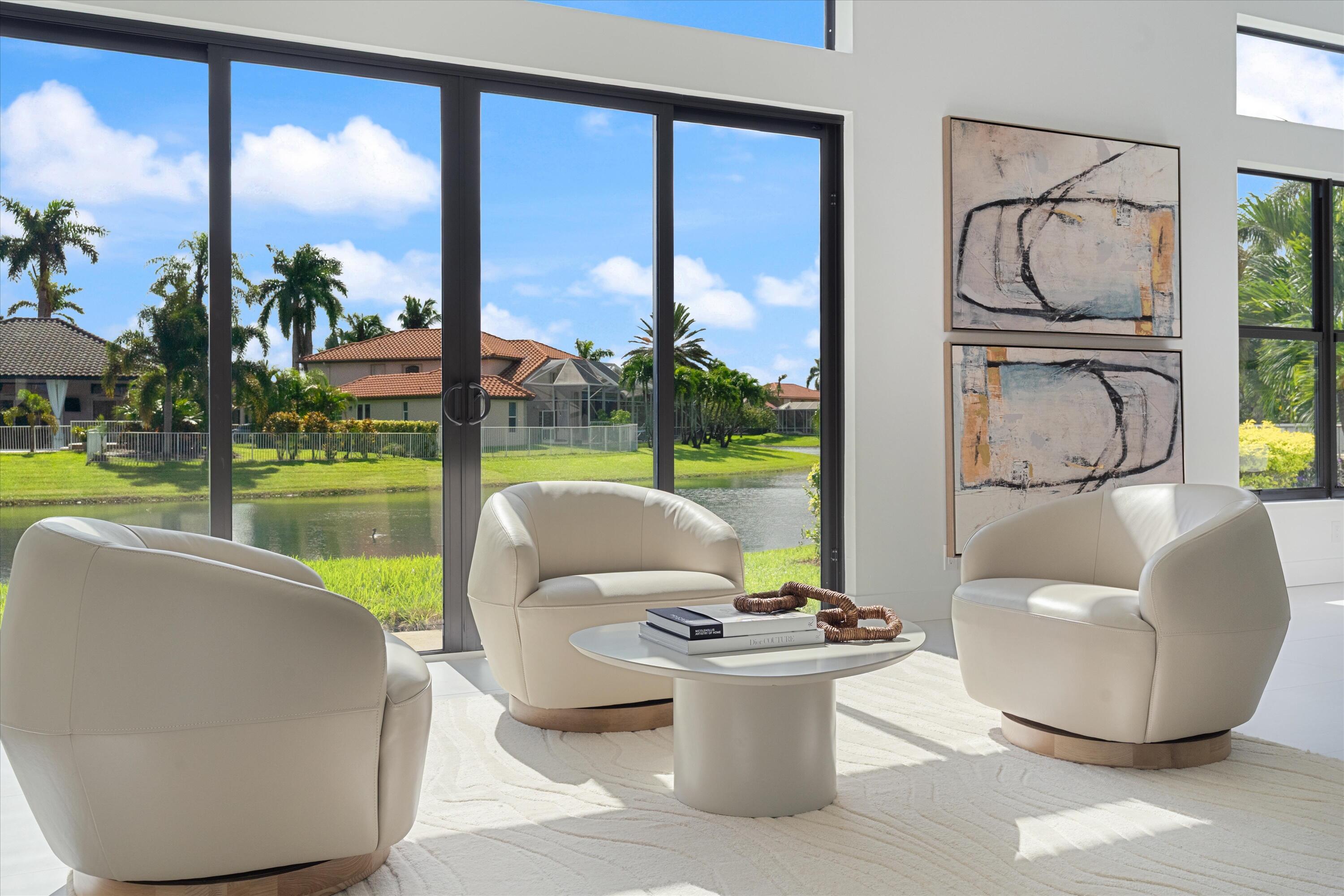 20209 Ocean Key Drive Boca Raton, FL 33498 - Photo 4 of 38 a living room with couch and a floor to ceiling window