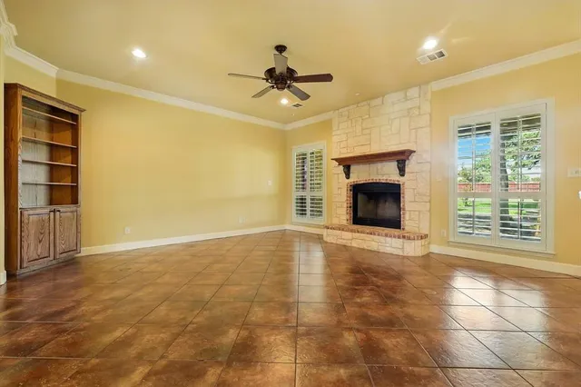 a view of interior space with wooden floor and a bathroom