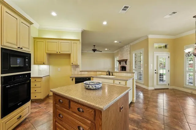 a spacious bathroom with a granite countertop sink mirror and
