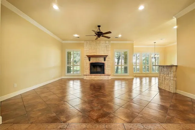 a dining room with furniture a chandelier and wooden floor