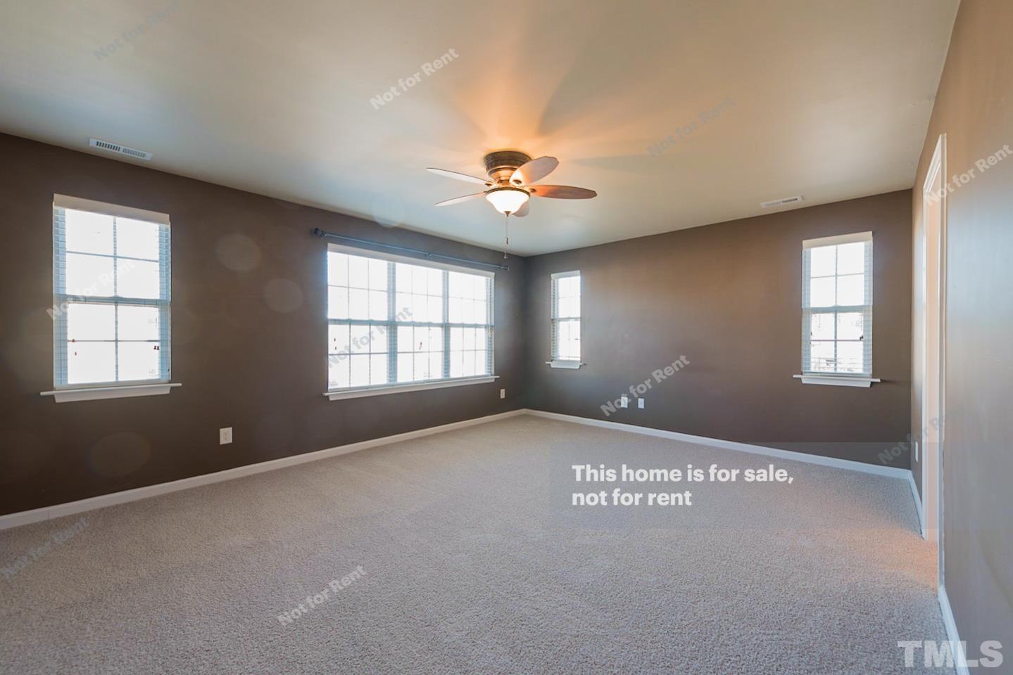 9801 Layla Avenue Raleigh, NC 27617 - Photo 13 of 17 a view of an empty room with a window