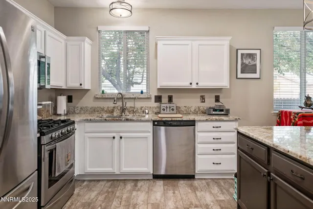 a bedroom with a bed chair and window