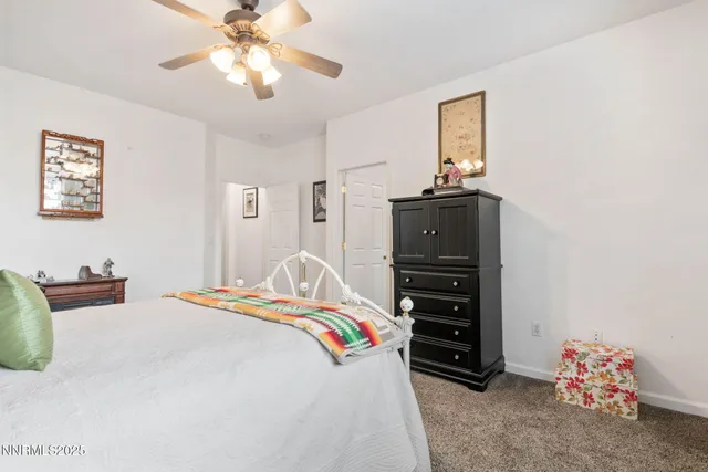 a bathroom with a double vanity sink mirror and shower
