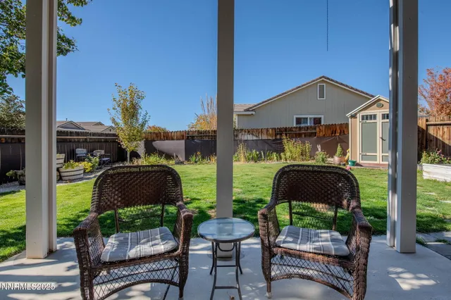 a view of a house with pool and a yard