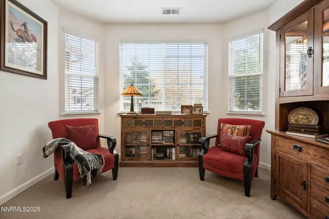 a view of a dining room with furniture window and outside view