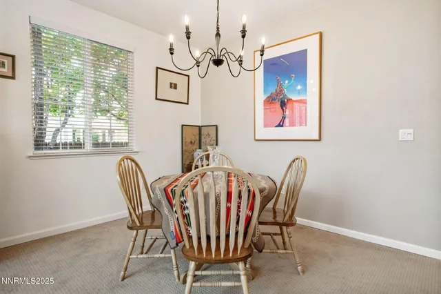 a kitchen with kitchen island granite countertop a sink cabinets and wooden floor