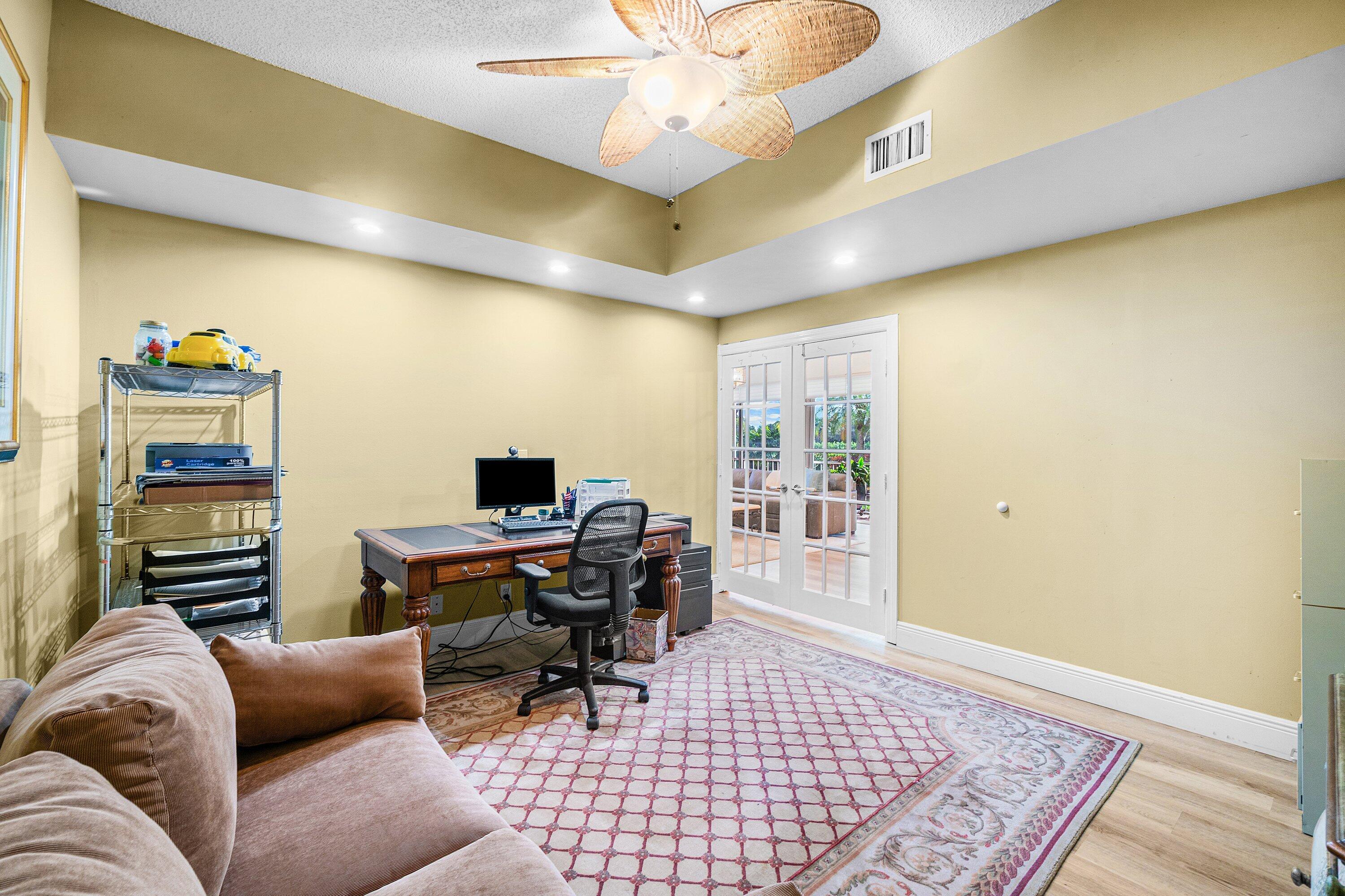5100 Lake Catalina Drive, Unit C Boca Raton, FL 33496 - Photo 21 of 42 a living room with furniture and a window