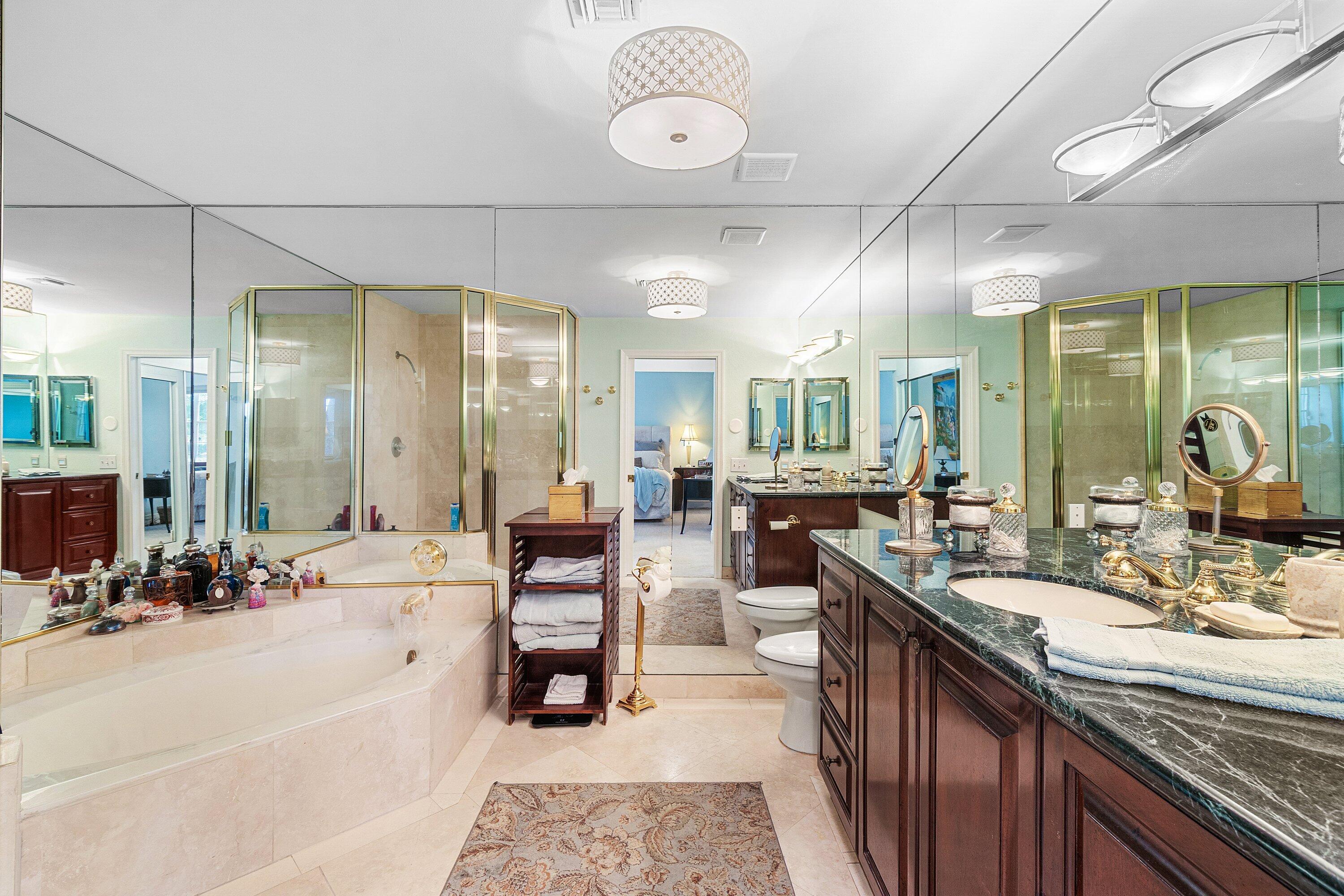 5100 Lake Catalina Drive, Unit C Boca Raton, FL 33496 - Photo 24 of 42 a large kitchen with kitchen island a large counter space a sink a window and living room view