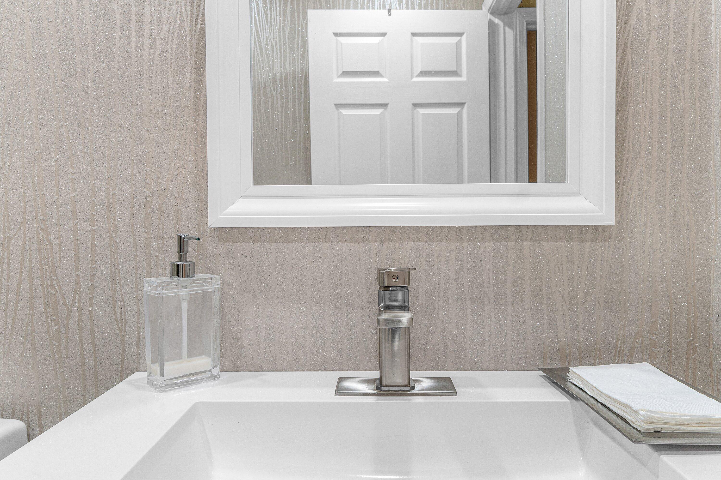 5100 Lake Catalina Drive, Unit C Boca Raton, FL 33496 - Photo 31 of 42 a bathroom with a sink and a mirror