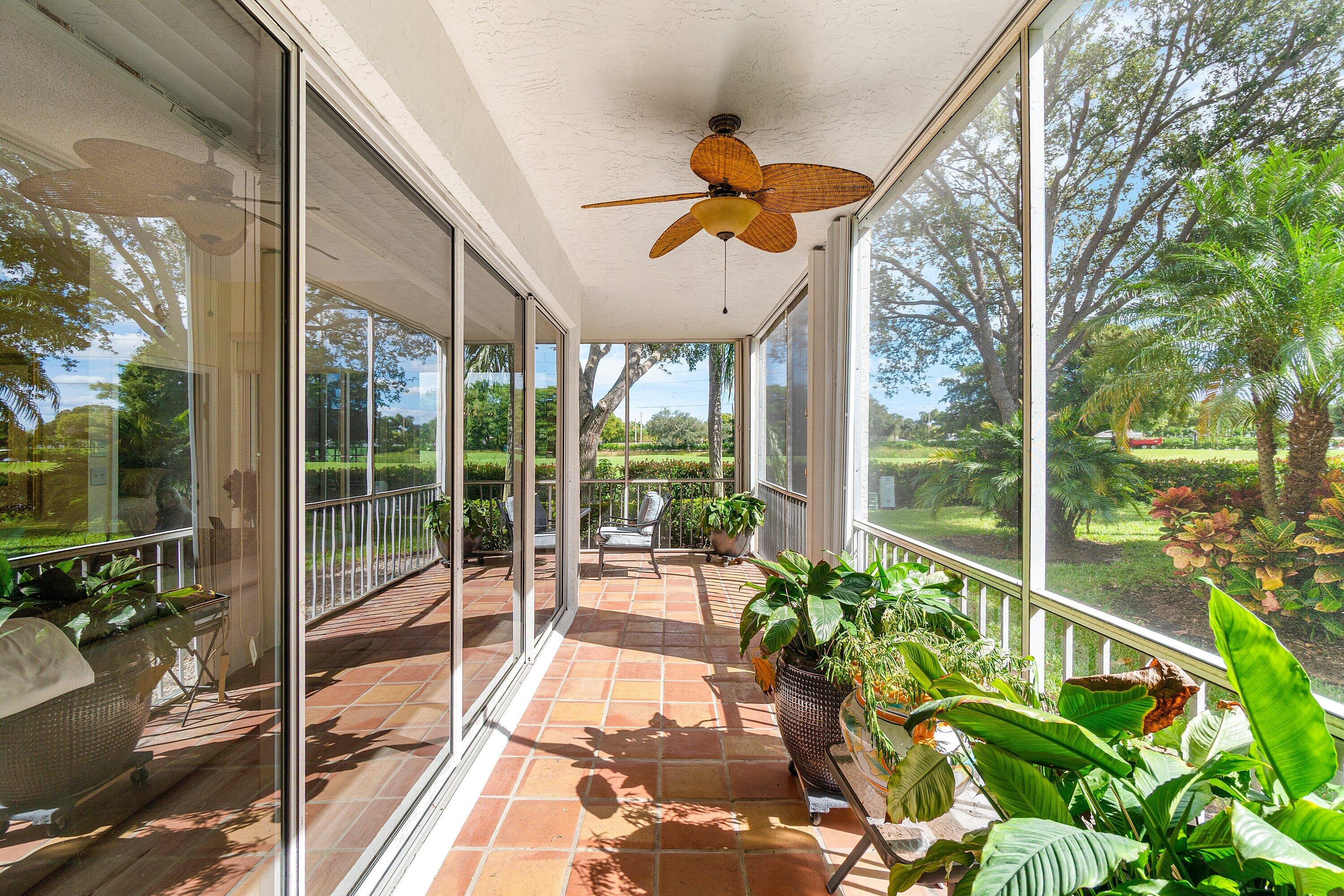 5100 Lake Catalina Drive, Unit C Boca Raton, FL 33496 - Photo 33 of 42 a view of a porch with furniture and garden