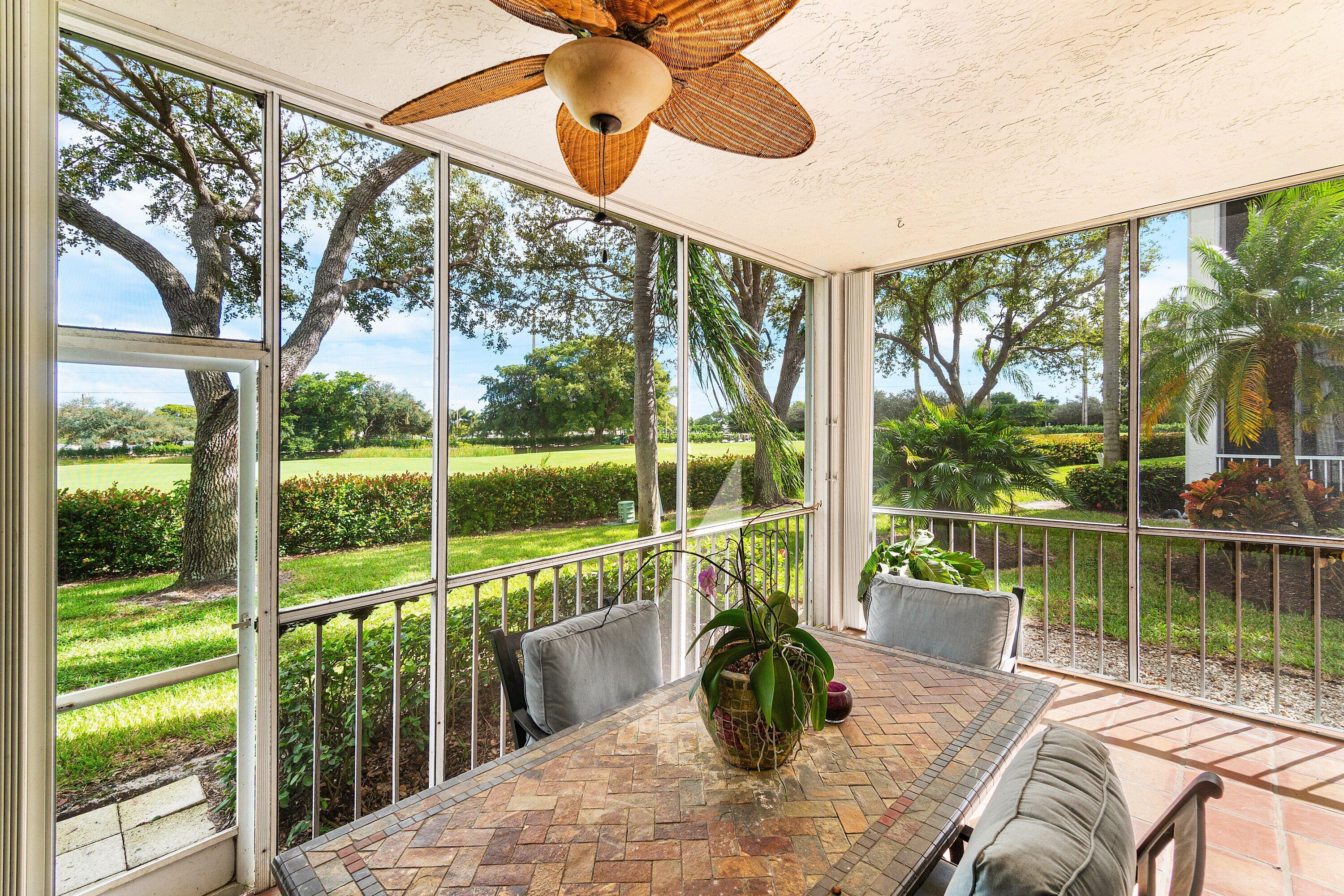 5100 Lake Catalina Drive, Unit C Boca Raton, FL 33496 - Photo 35 of 42 a view of a balcony with lake view and a large window
