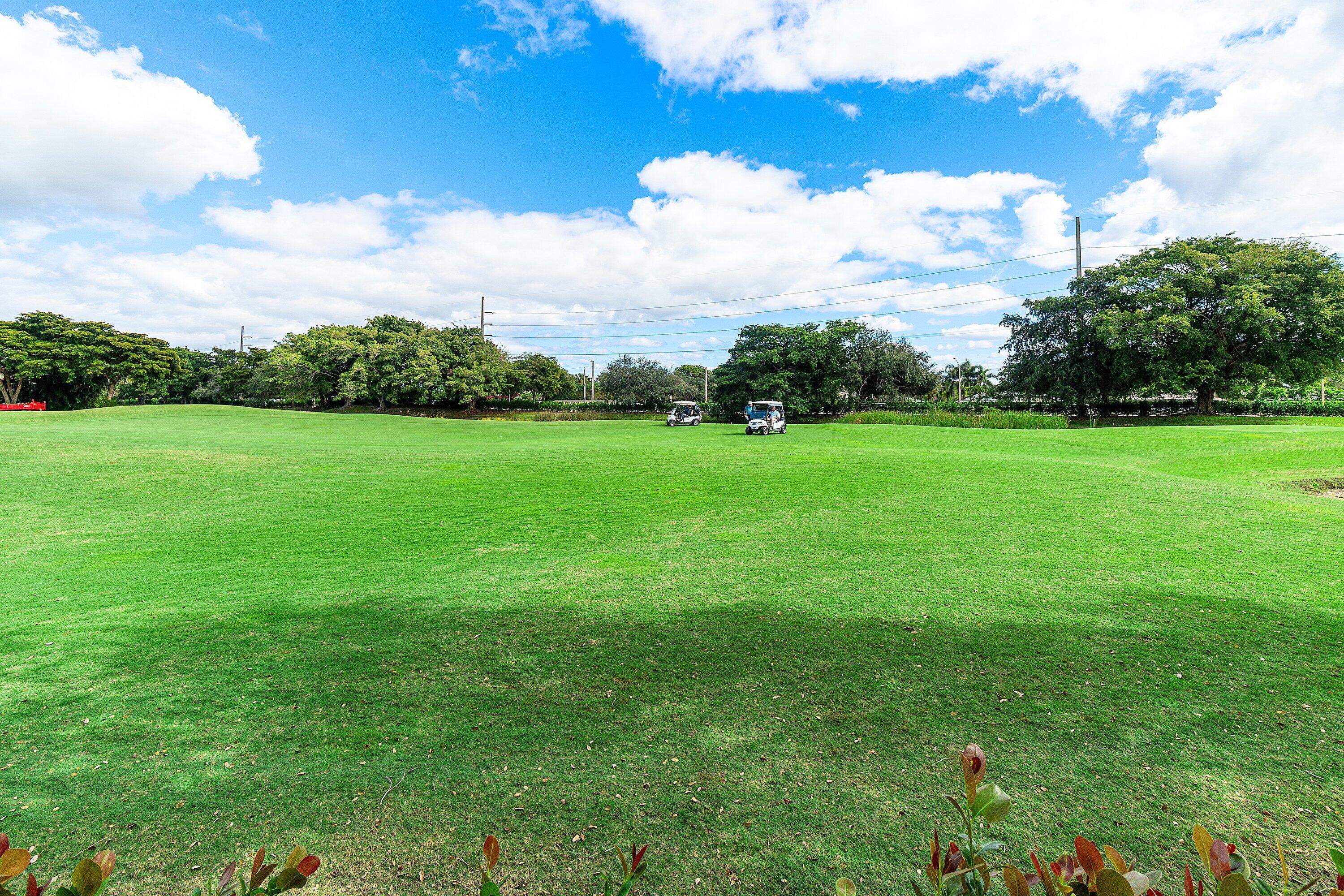 5100 Lake Catalina Drive, Unit C Boca Raton, FL 33496 - Photo 40 of 42 a view of an outdoor space and a yard