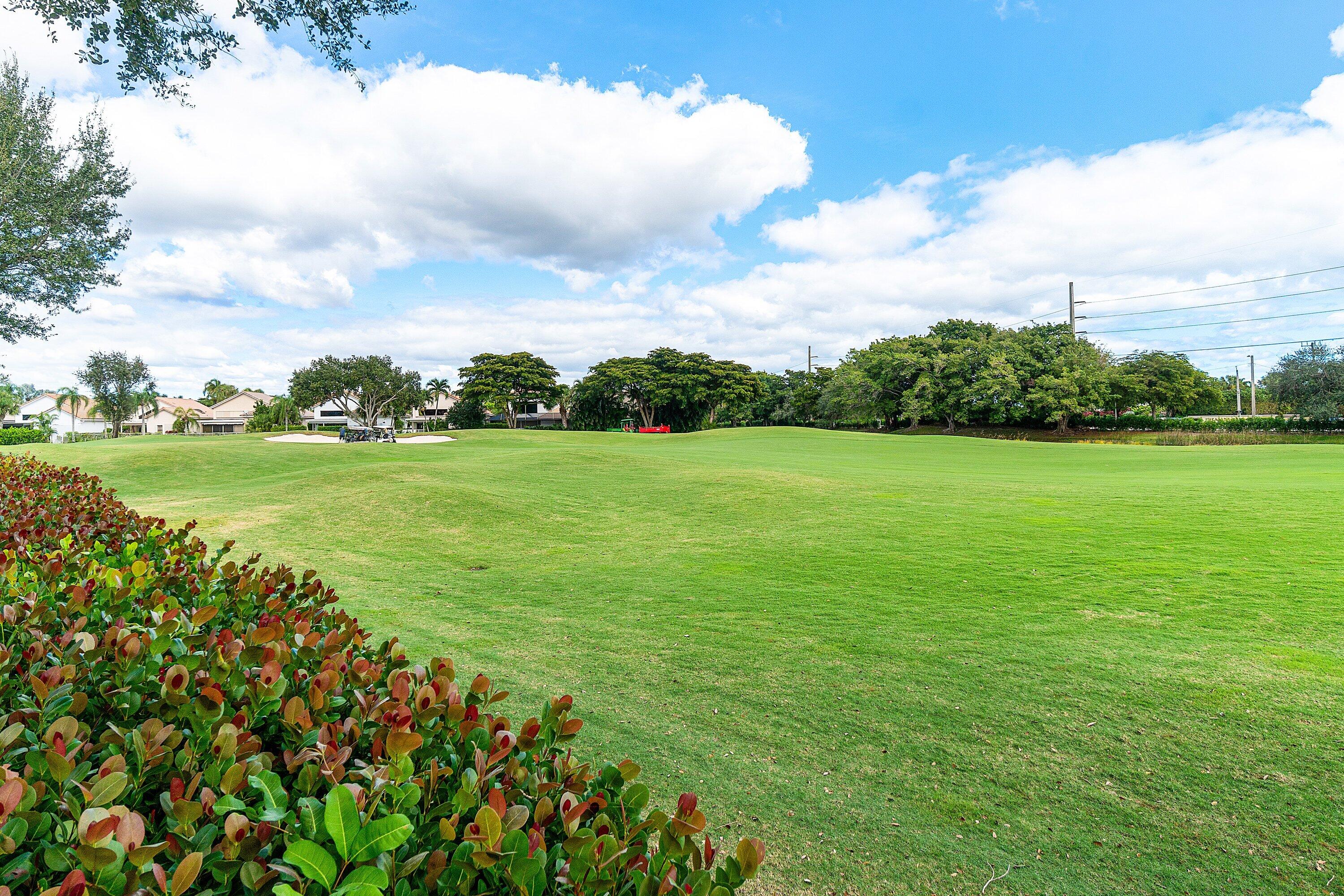 5100 Lake Catalina Drive, Unit C Boca Raton, FL 33496 - Photo 41 of 42 a view of a golf course with a garden