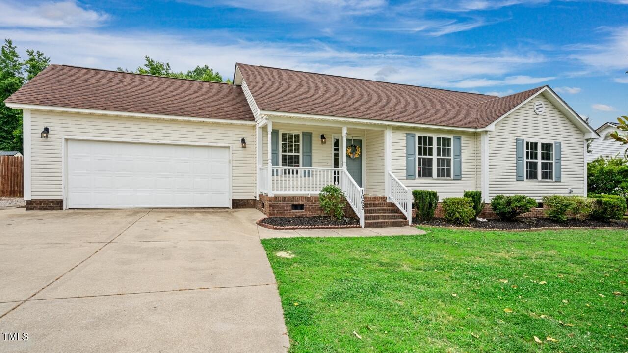 1065 Smith Road Smithfield, NC 27577 - Photo 1 of 36 a view of a house with backyard and porch