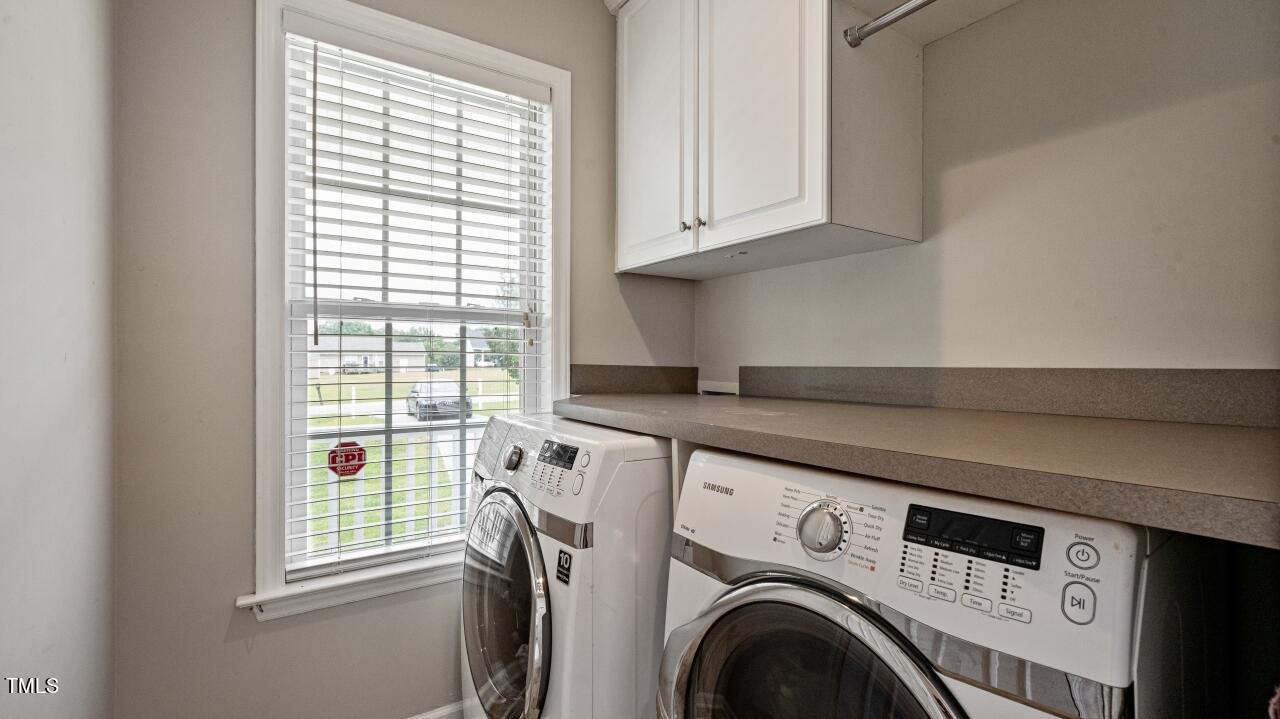 1065 Smith Road Smithfield, NC 27577 - Photo 13 of 36 a utility room with dryer and washer
