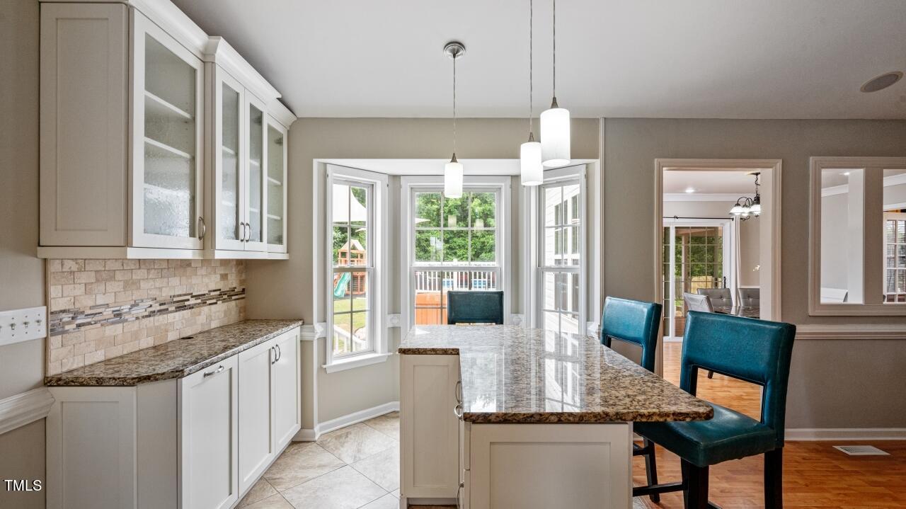 1065 Smith Road Smithfield, NC 27577 - Photo 15 of 36 a kitchen with stainless steel appliances granite countertop counter space a sink and cabinets
