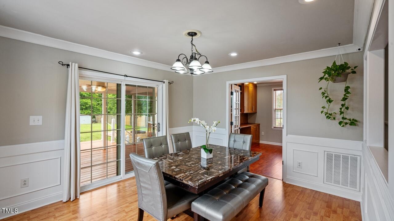 1065 Smith Road Smithfield, NC 27577 - Photo 17 of 36 a living room with furniture and wooden floor